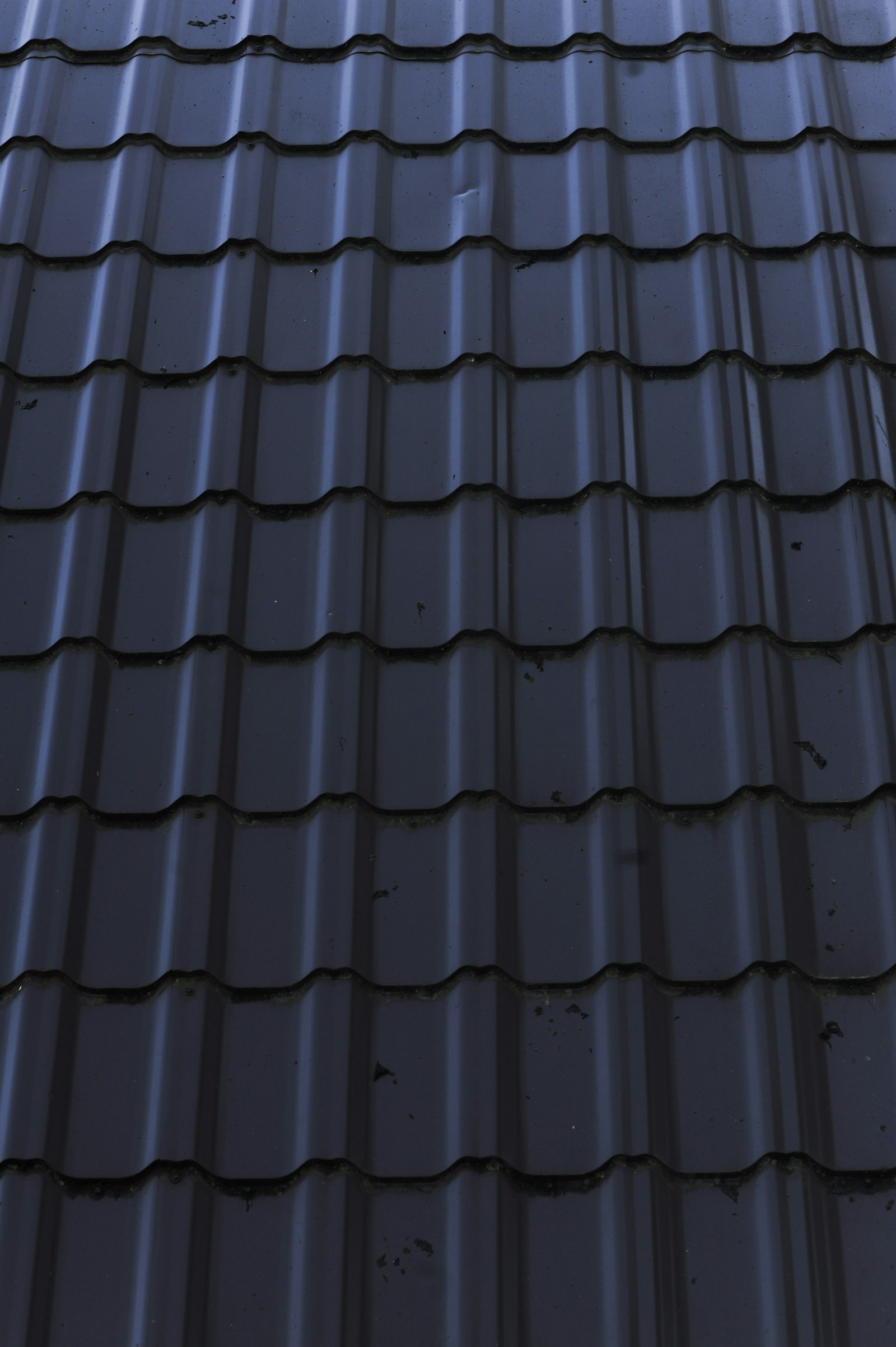Old worn roof being stripped before re-roofing