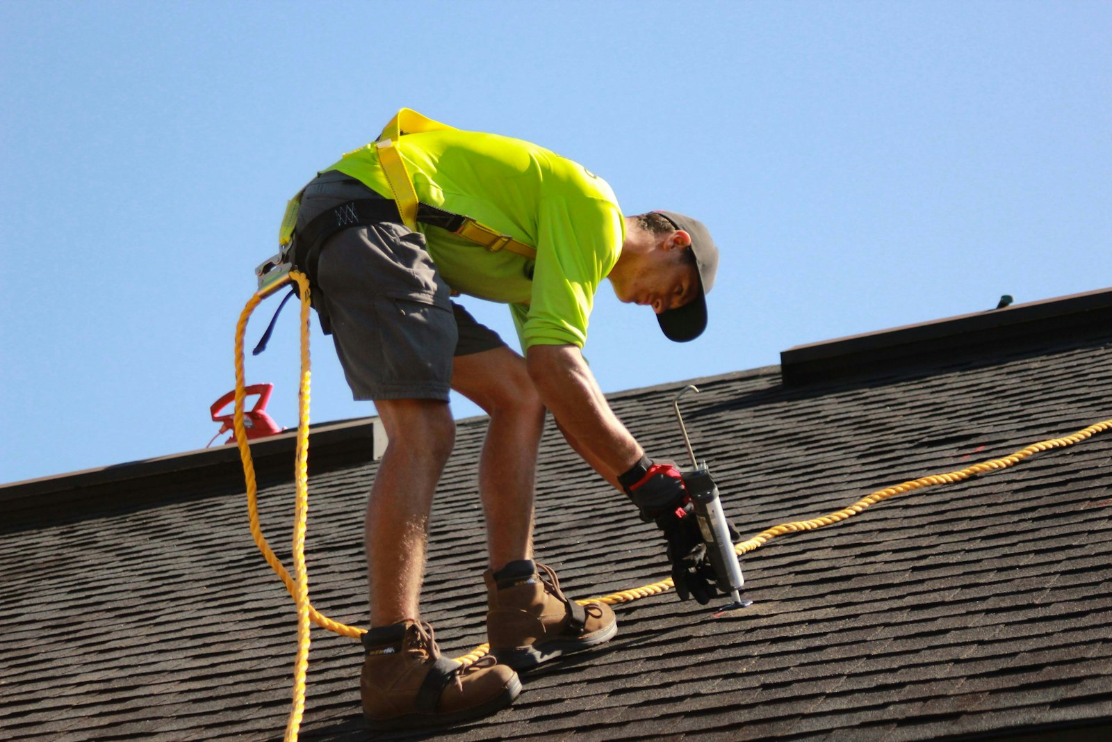Roofer fixing a pitched roof on a South Auckland home