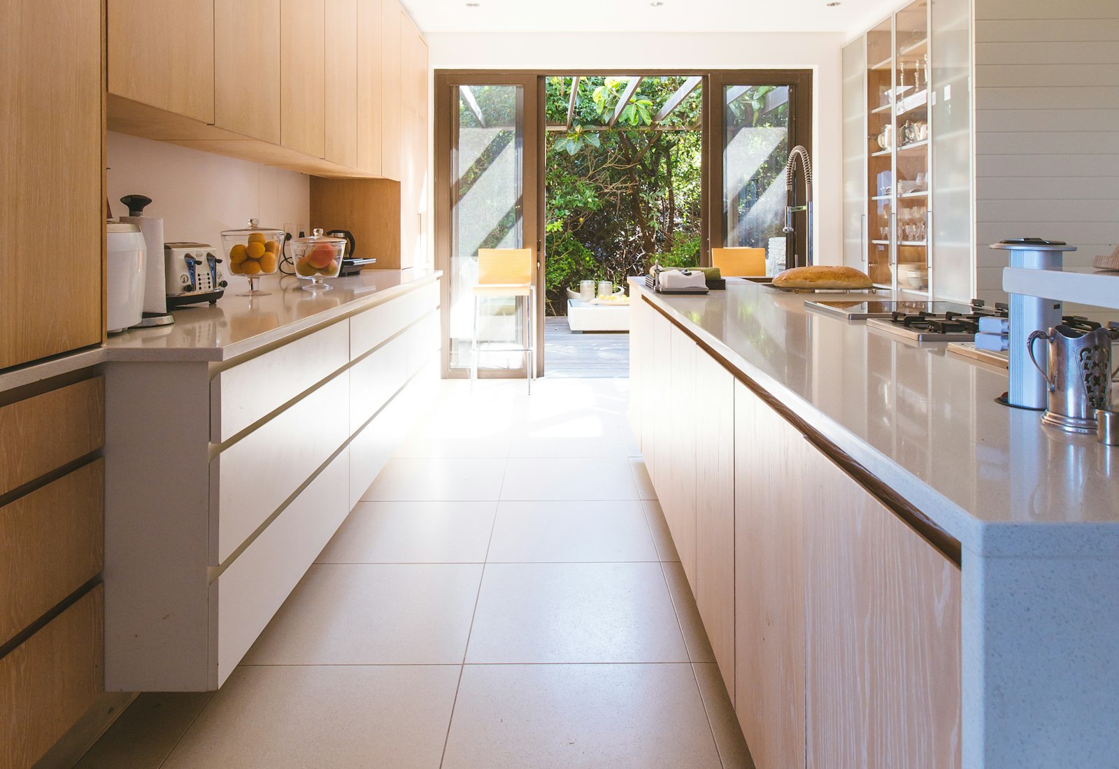 Stone benchtop and island in a finished Auckland kitchen